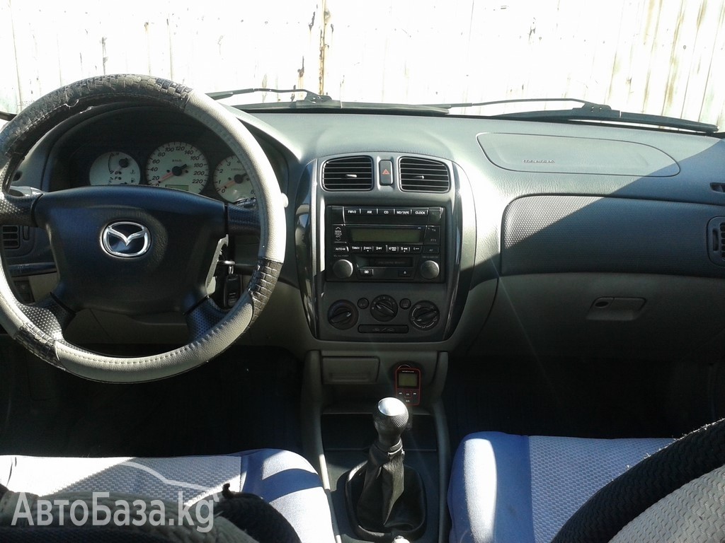 Mazda 323 2002 года за ~260 600 сом